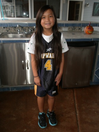 Kasen in her Upward basketball uniform